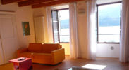 Spacious living room, with new oak floors, exposed ceiling beams, and new (2010) contemporary furnishings!