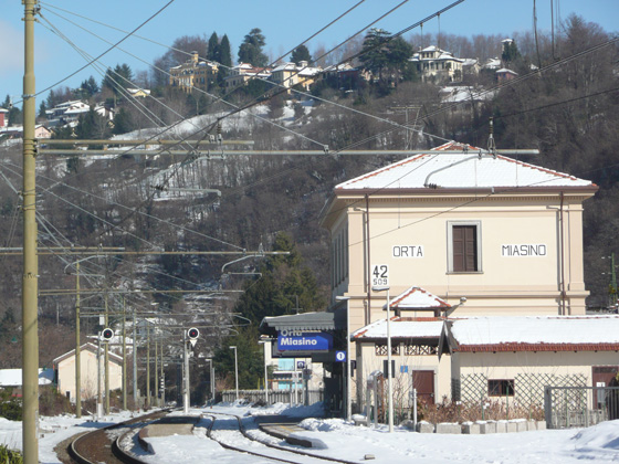 Orta-Miasino station in the snow, with the village of Miasino in the distance on the top of the hill (taken 15/2/2012)
